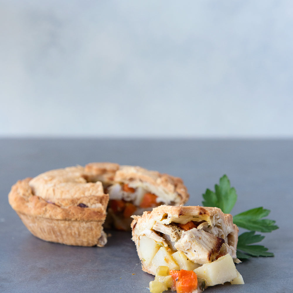 gluten free chicken pot pie, with piece cut out displayed in front