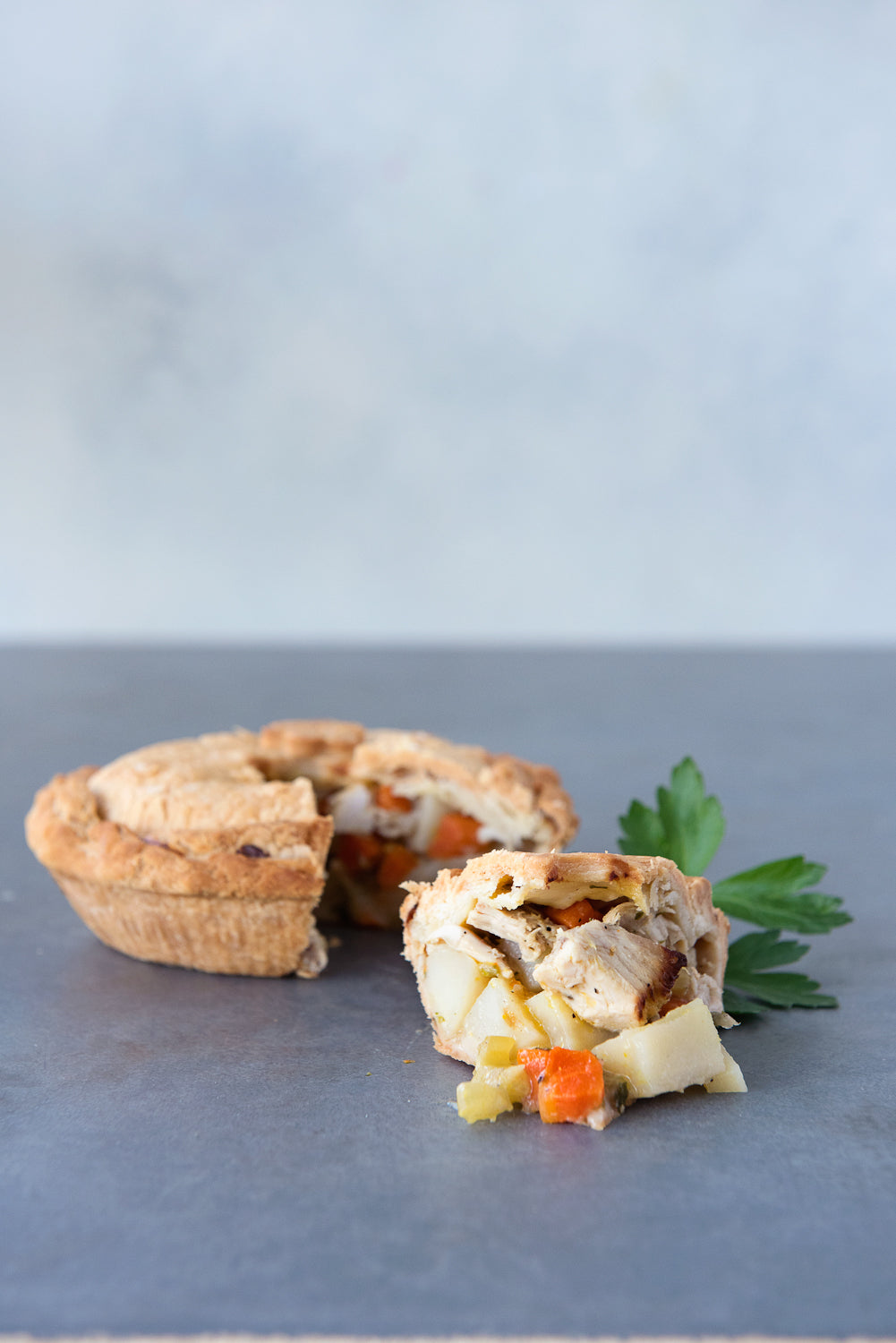 gluten free chicken pot pie, with piece cut out displayed in front