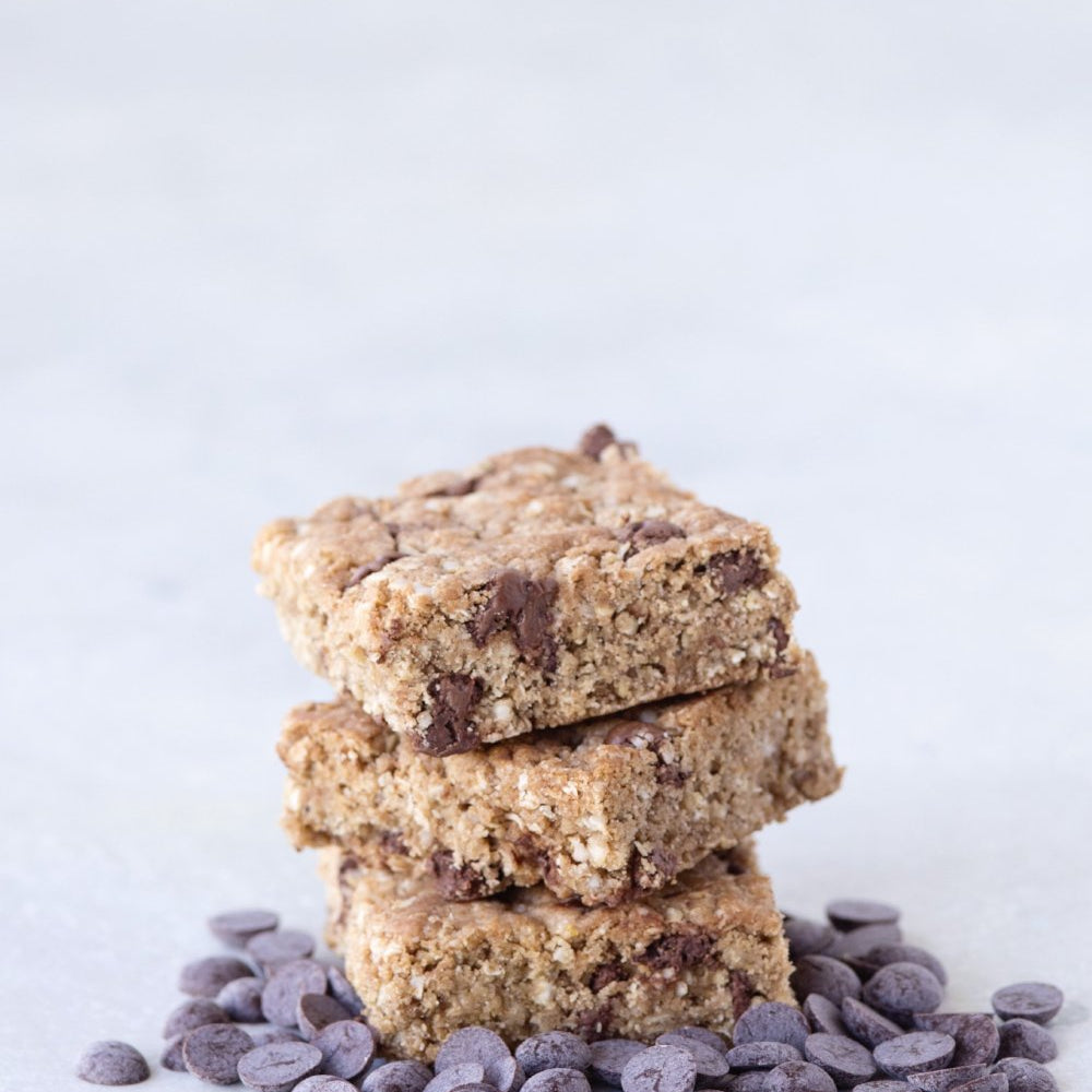 stack of 3 gluten free vegan chocolate chip cookie bars shown with Michel Cluizel soy-free dark chocolate chips
